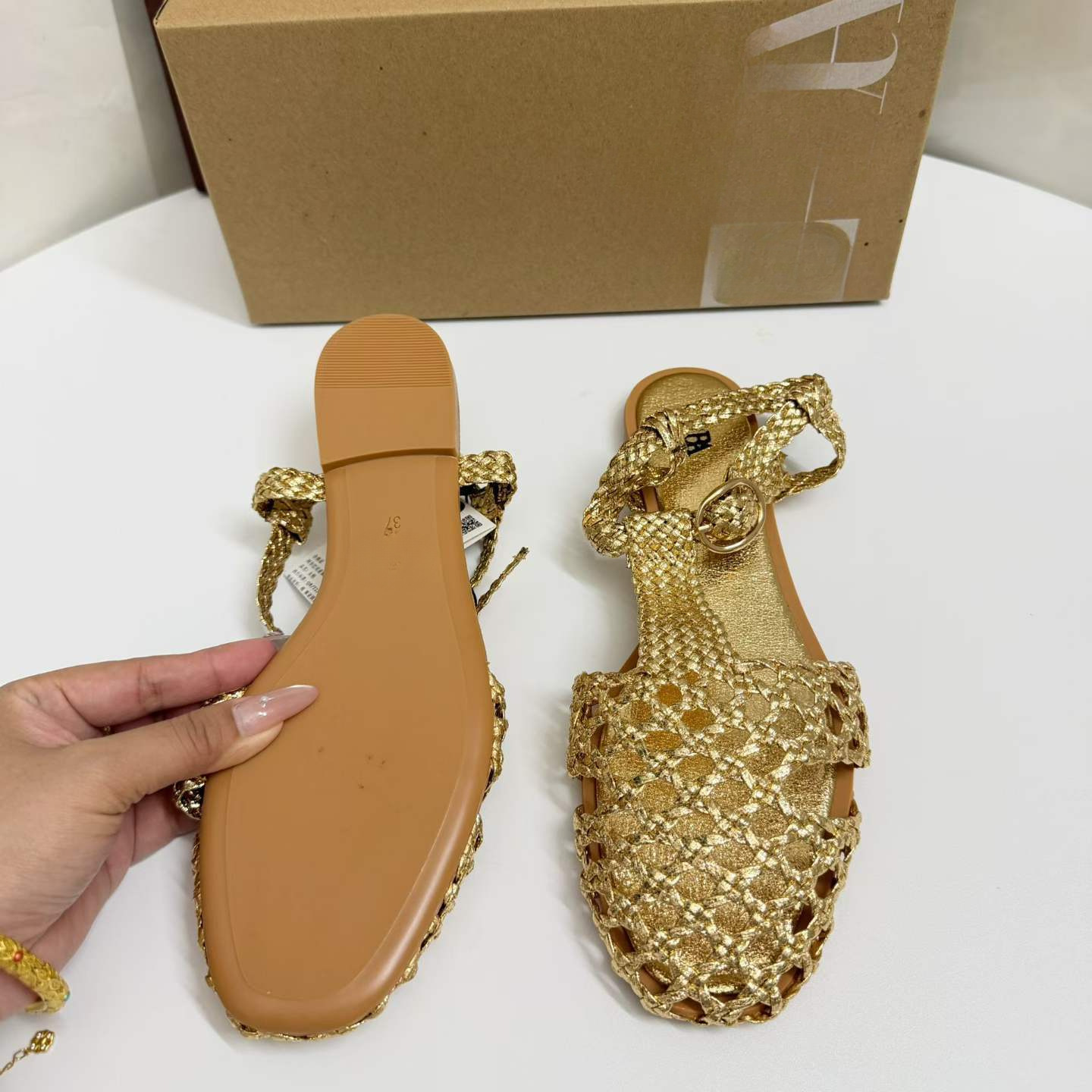 JHC-HB-249 | Woven Cutout Metallic Gold Round-Toe Flat Gladiator Sandal angle 3
